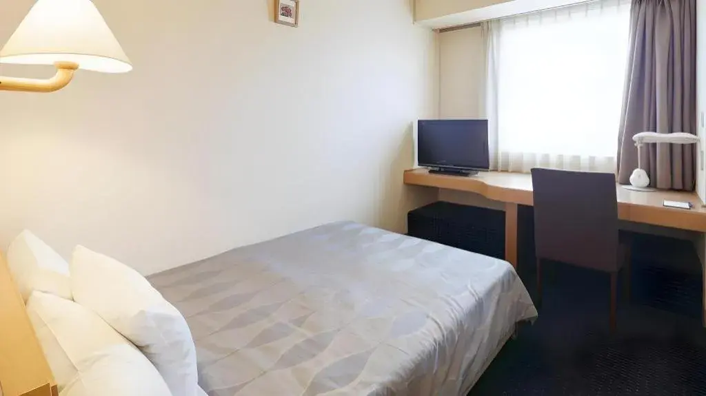 Bed in Roco Inn Matsuyama Bed in Roco Inn Matsuyama