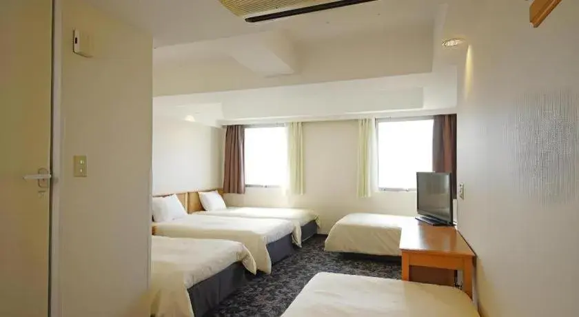 Bed in Nansei Kanko Hotel Bed in Nansei Kanko Hotel