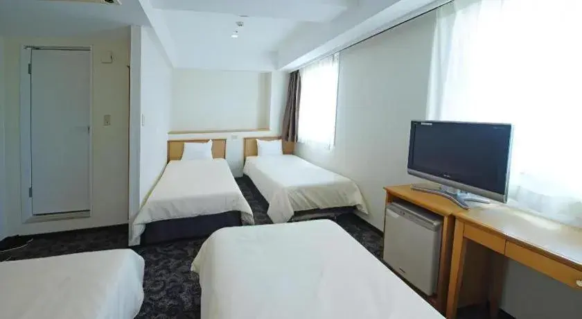 Bed in Nansei Kanko Hotel Bed in Nansei Kanko Hotel