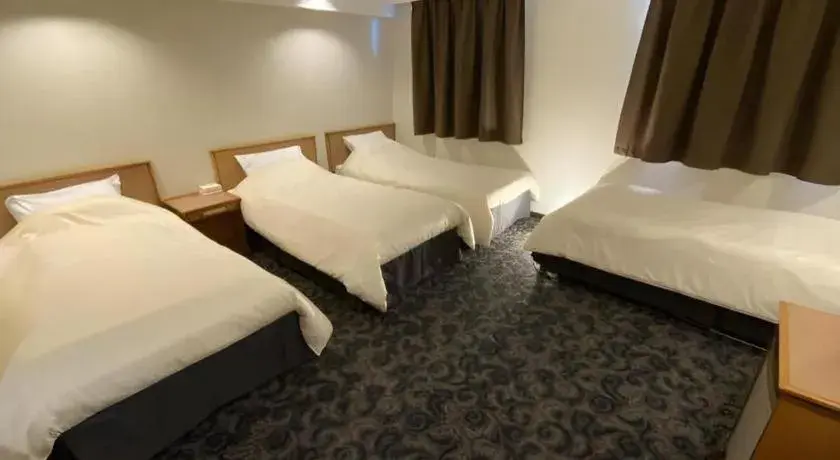 Bed in Nansei Kanko Hotel Bed in Nansei Kanko Hotel