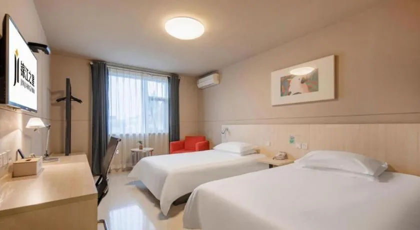 Bed in Jinjiang Inn Hangzhou Lin'an Qianwang Street