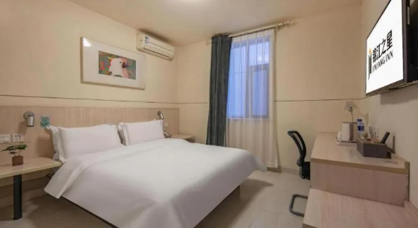 Bed in Jinjiang Inn Hangzhou Lin'an Qianwang Street