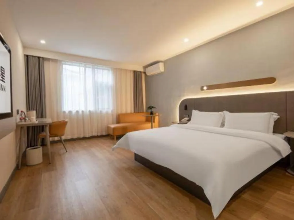 Bed in Jinjiang Inn Hangzhou Lin'an Qianwang Street