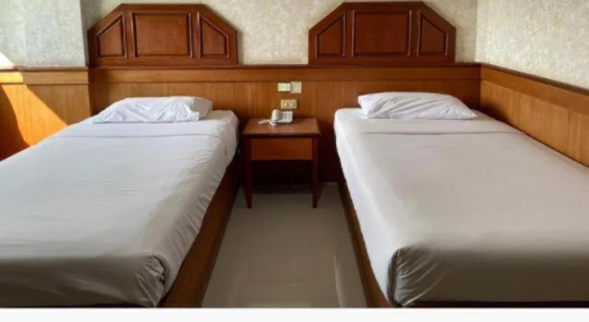 Bed in Sakol Grand Palace Hotel