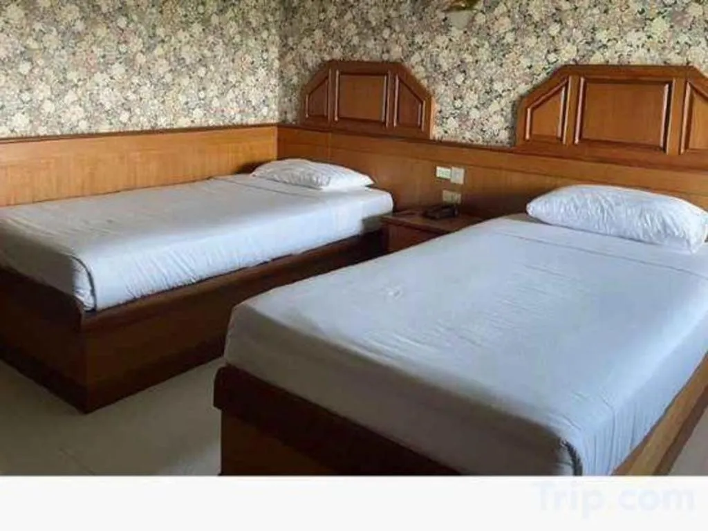 Bed in Sakol Grand Palace Hotel