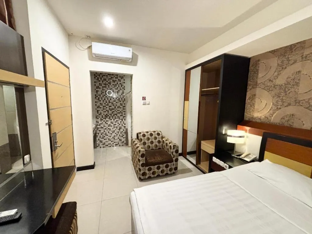 Bed in Sumber Ria Hotel