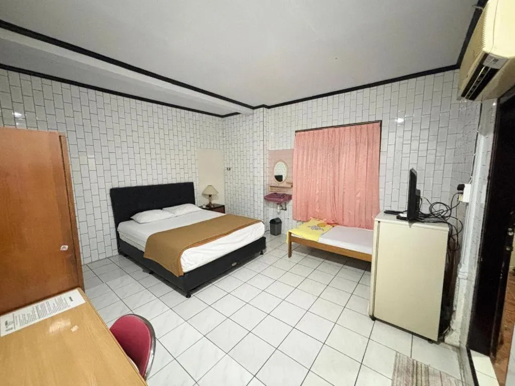 Bed in Sumber Ria Hotel