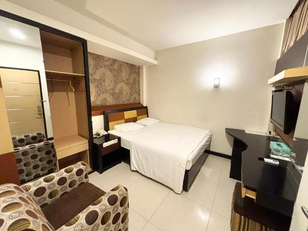 Bed in Sumber Ria Hotel