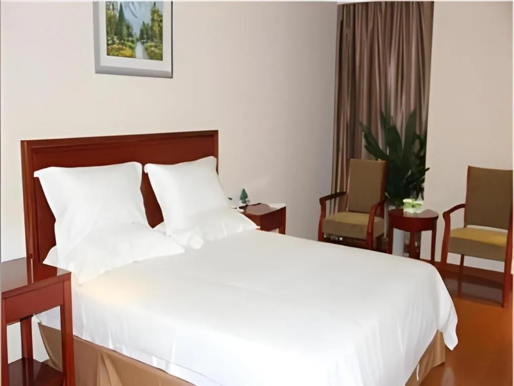 Bed in GreenTree Inn Jiaxing Zhongan Business Hotel