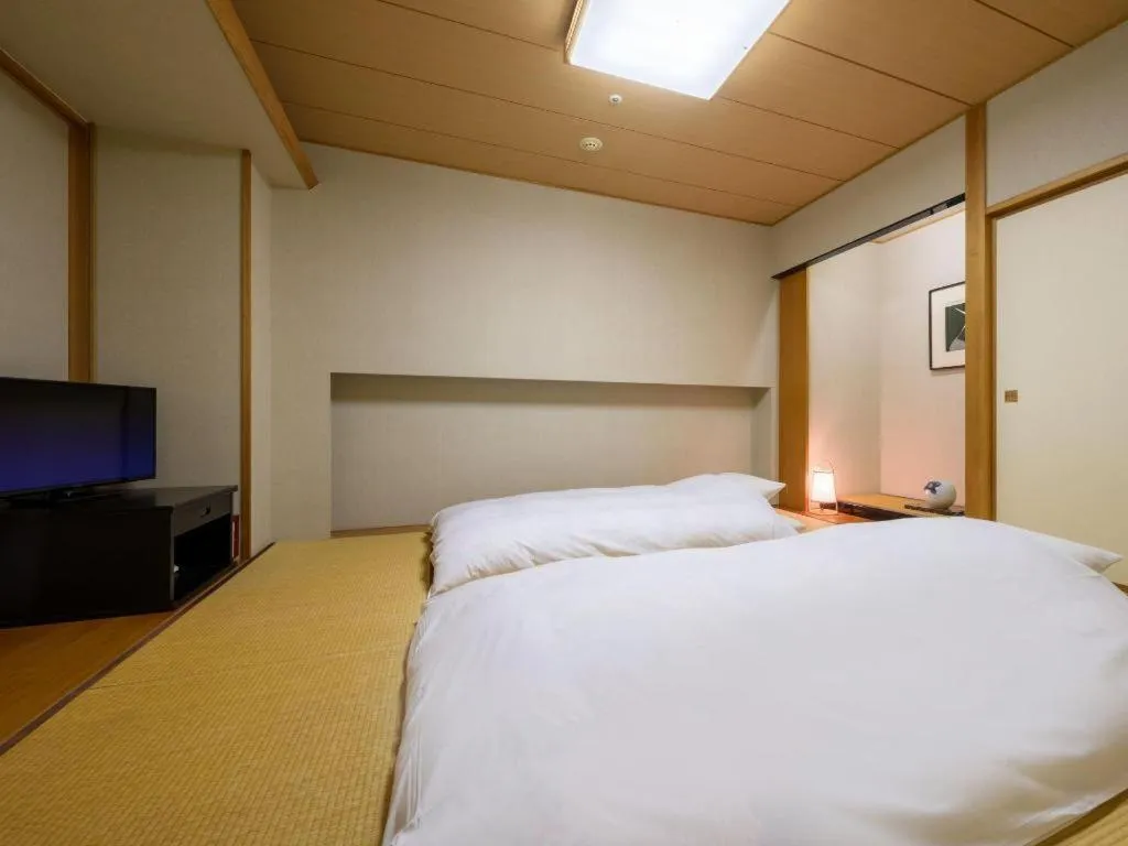 Bed in Grand Hotel New Oji
