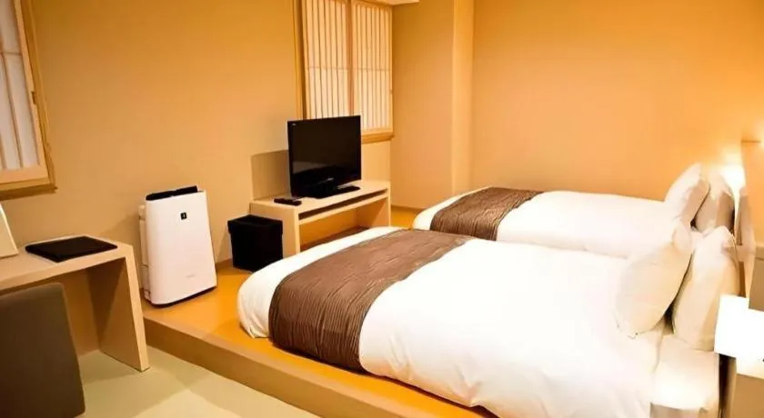 Bed in Spa Land Hotel Naito