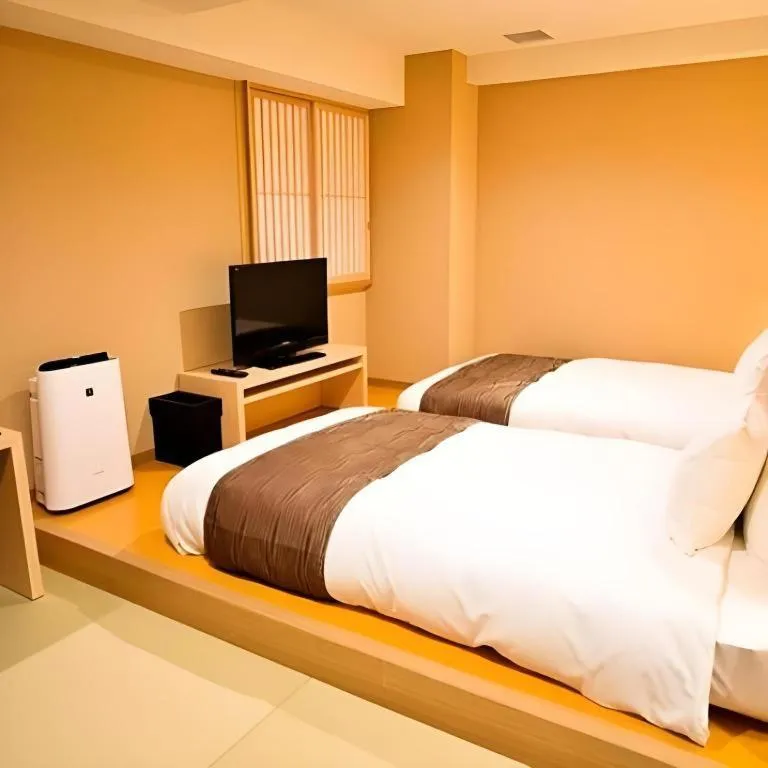 Bed in Spa Land Hotel Naito