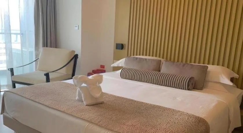 Bed in Huafa Executive Apartment Hotel Zhuhai