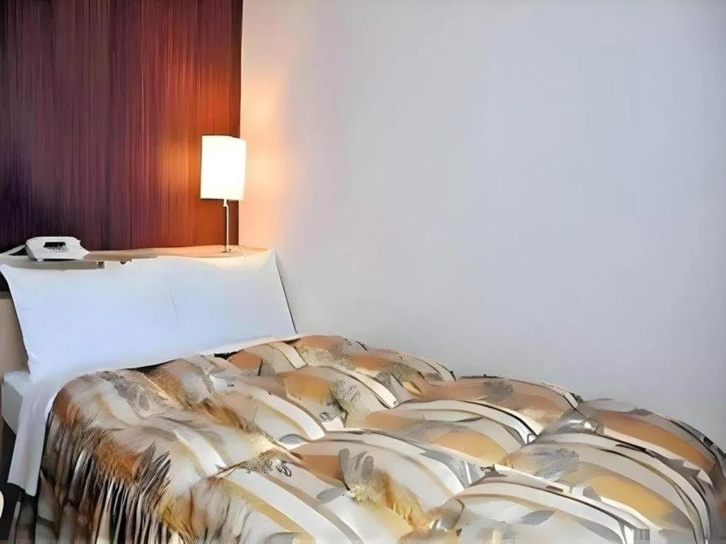 Bed in Hotel Castle Plaza