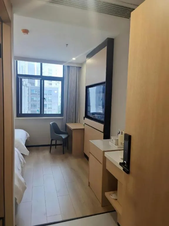 Bed in GreenTree Inn Shanghai Songjiang WanDa Plaza RonGMEi Road Express Hotel