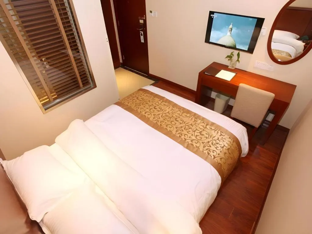 Bed in GreenTree Inn Shanghai Songjiang WanDa Plaza RonGMEi Road Express Hotel