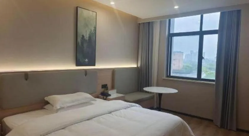 Bed in GreenTree Inn Shanghai Songjiang WanDa Plaza RonGMEi Road Express Hotel