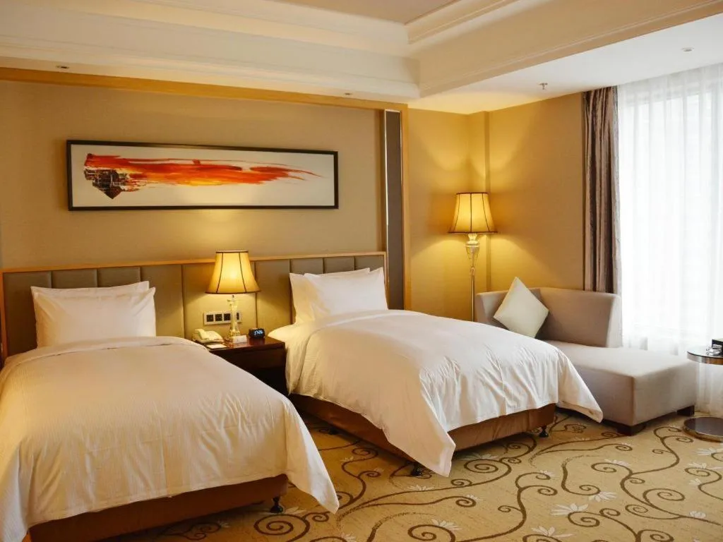 Bed in Wyndham Grand Plaza Royale Mingfa Zhangzhou
