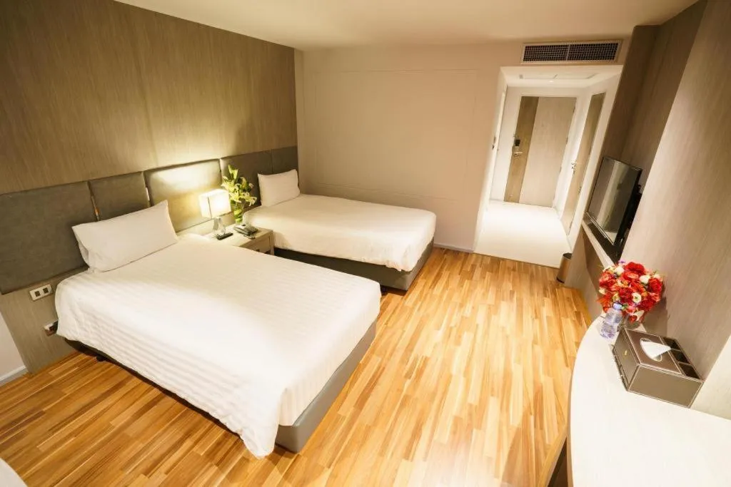 Bed in New Season Square Hotel