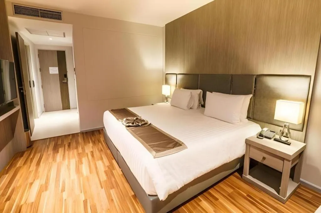 Bed in New Season Square Hotel