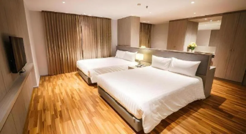 Bed in New Season Square Hotel