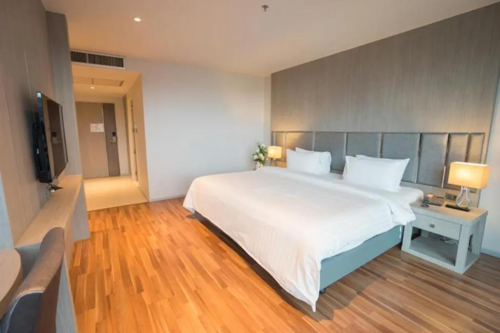 Bed in New Season Square Hotel