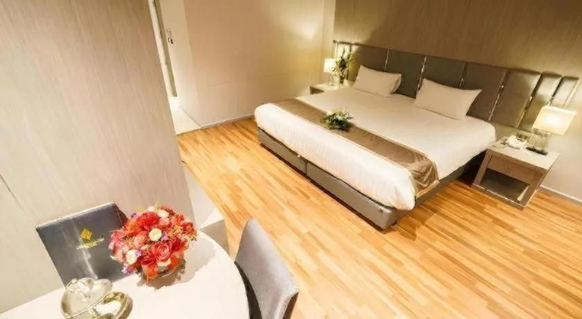 Bed in New Season Square Hotel