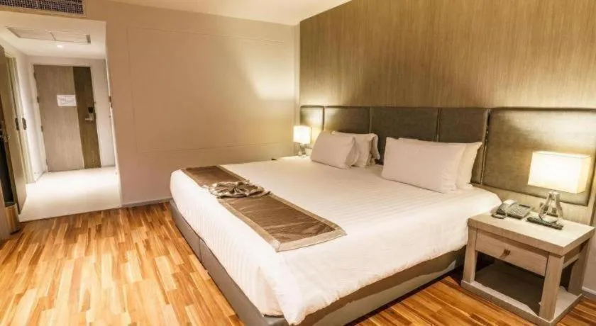 Bed in New Season Square Hotel