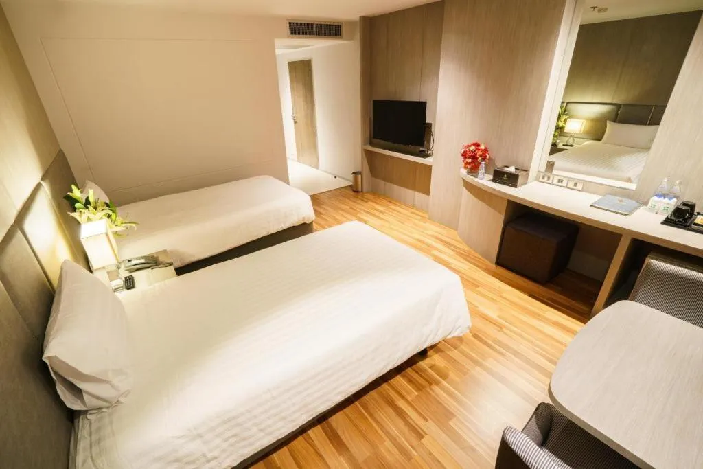 Bed in New Season Square Hotel