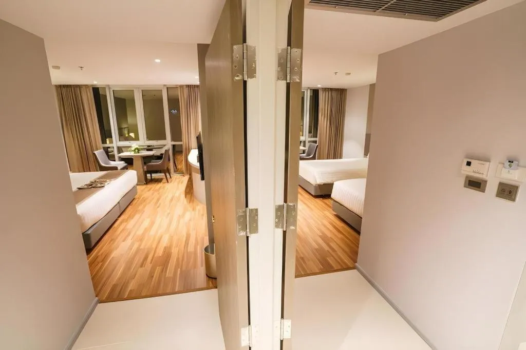 Bed in New Season Square Hotel