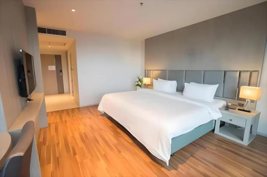 Bed in New Season Square Hotel