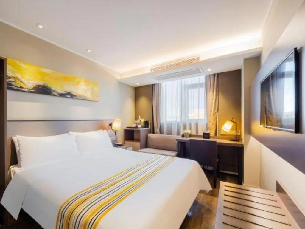 Bed in Home Inn Plus Shanghai Zhangjiang Guanglan Road Metro Station