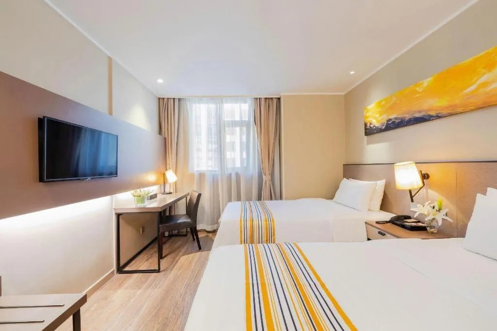 Bed in Home Inn Plus Shanghai Zhangjiang Guanglan Road Metro Station