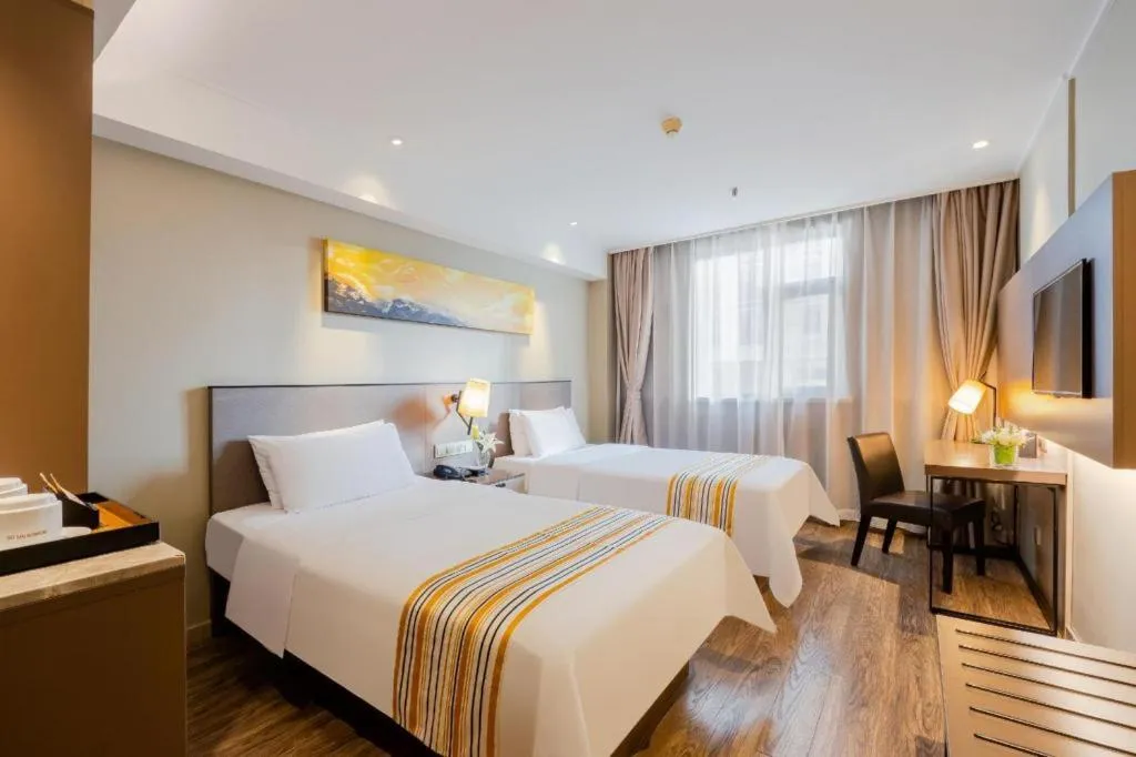 Bed in Home Inn Plus Shanghai Zhangjiang Guanglan Road Metro Station