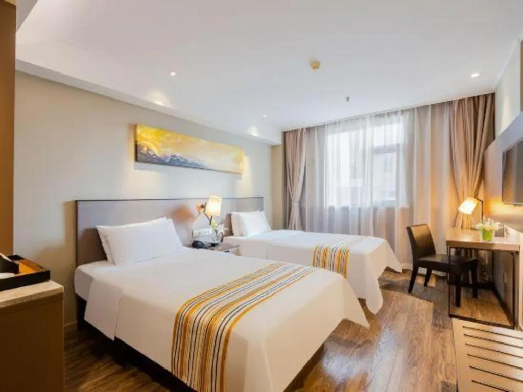 Bed in Home Inn Plus Shanghai Zhangjiang Guanglan Road Metro Station