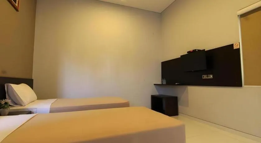 Bed in MANDARI HOTEL SINGARAJA