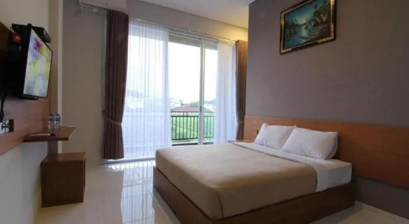 Bed in MANDARI HOTEL SINGARAJA