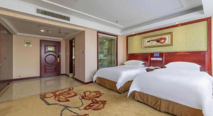 Bed in Vienna Hotel Yangzhou Outlets Plaza He Garden
