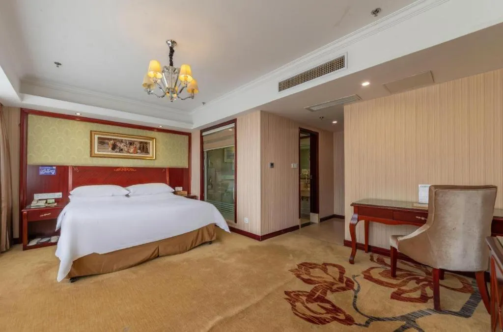 Bed in Vienna Hotel Yangzhou Outlets Plaza He Garden