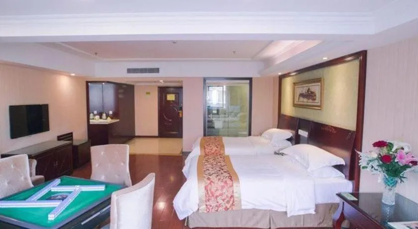 Bed in Vienna Hotel Yangzhou Outlets Plaza He Garden