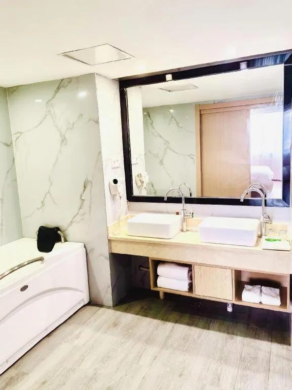 Bed in Vienna Hotel Yangzhou Outlets Plaza He Garden