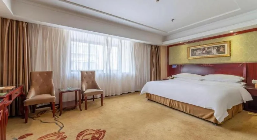 Bed in Vienna Hotel Yangzhou Outlets Plaza He Garden