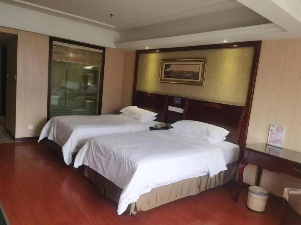 Bed in Vienna Hotel Yangzhou Outlets Plaza He Garden