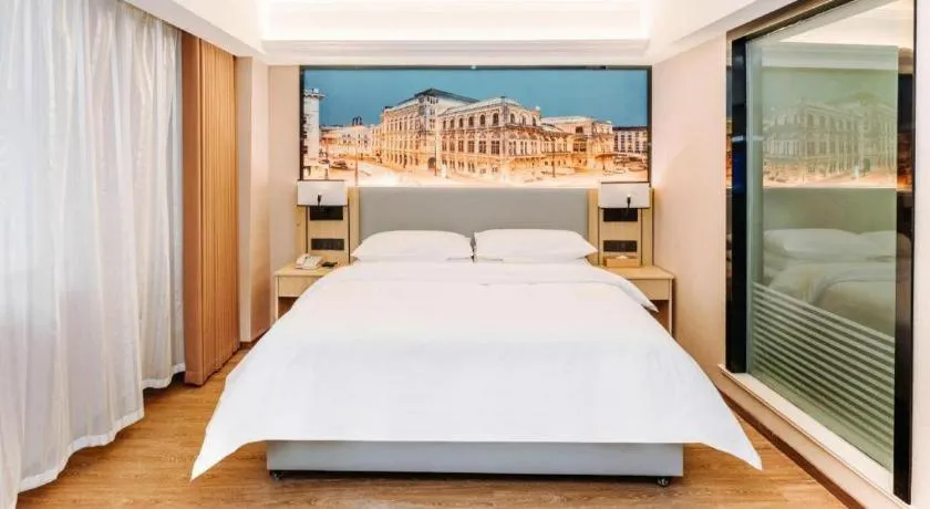 Bed in Vienna Hotel Yangzhou Outlets Plaza He Garden