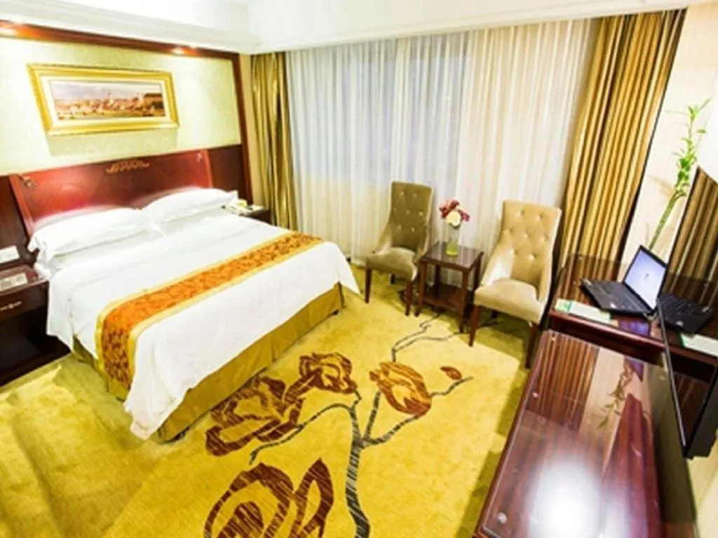 Bed in Vienna Hotel Yangzhou Outlets Plaza He Garden