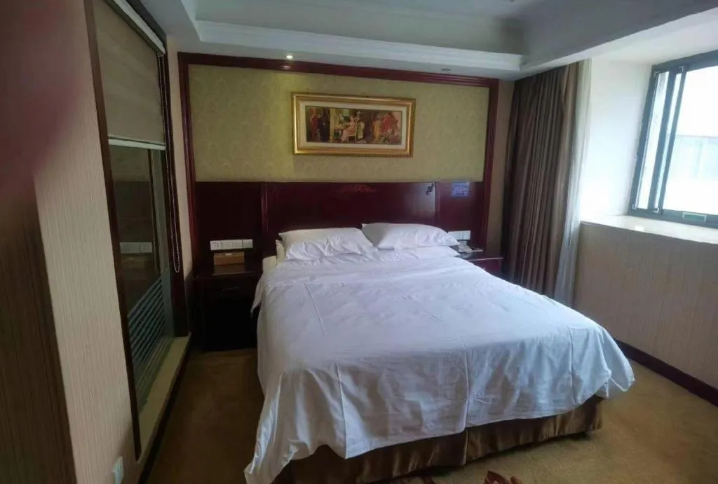 Bed in Vienna Hotel Yangzhou Outlets Plaza He Garden