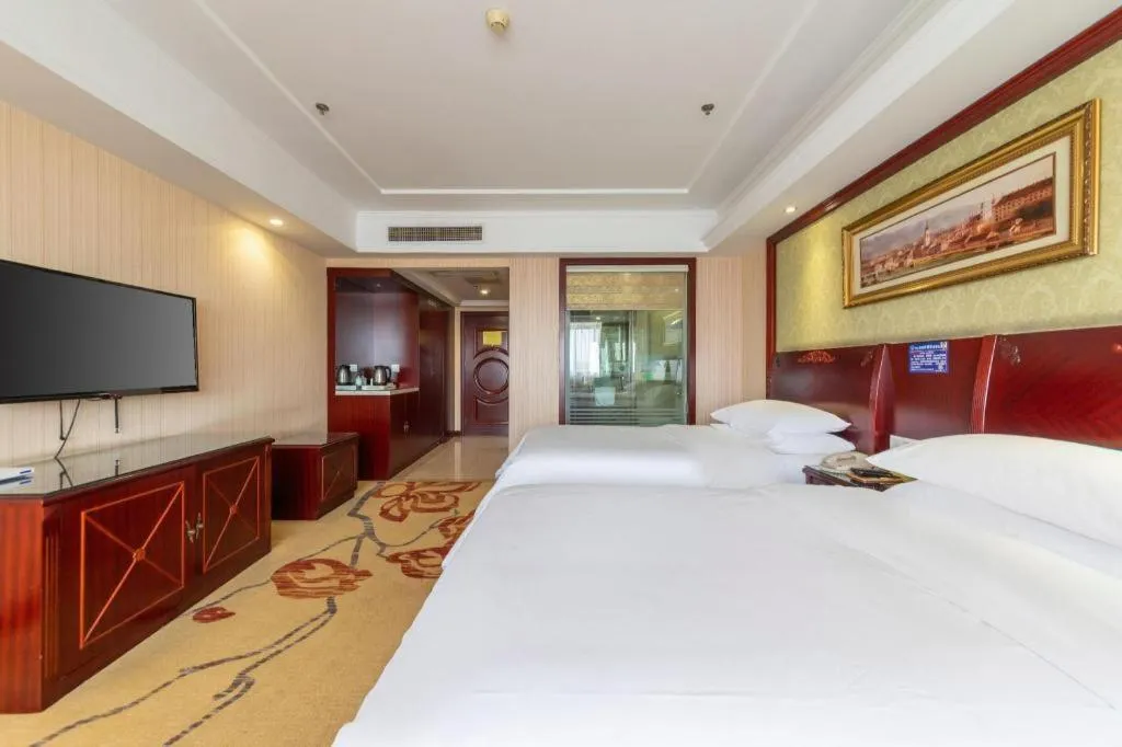 Bed in Vienna Hotel Yangzhou Outlets Plaza He Garden