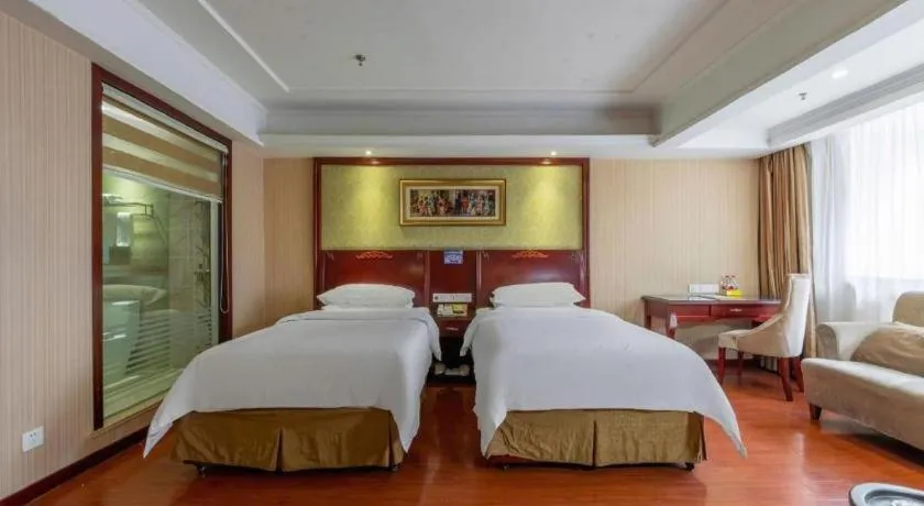 Bed in Vienna Hotel Yangzhou Outlets Plaza He Garden