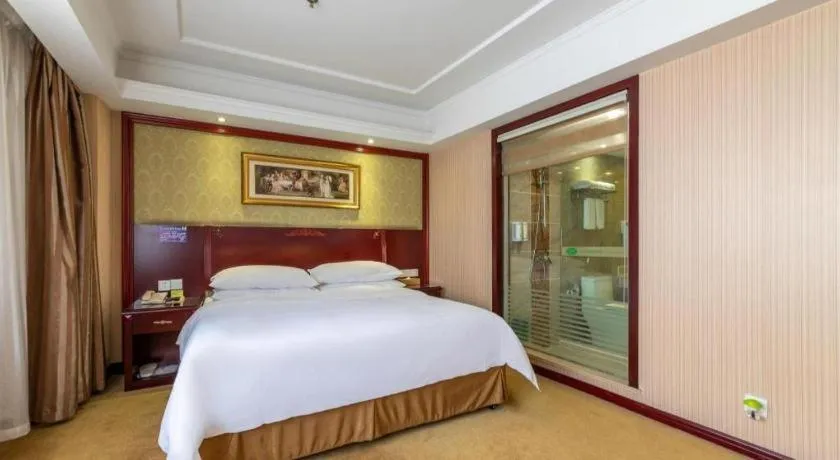Bed in Vienna Hotel Yangzhou Outlets Plaza He Garden