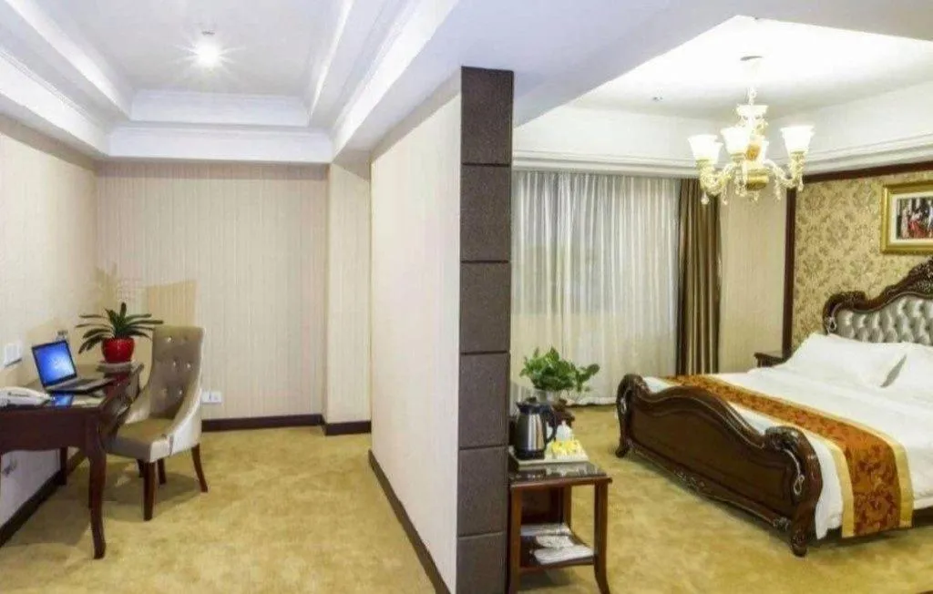 Bed in Vienna Hotel Yangzhou Outlets Plaza He Garden